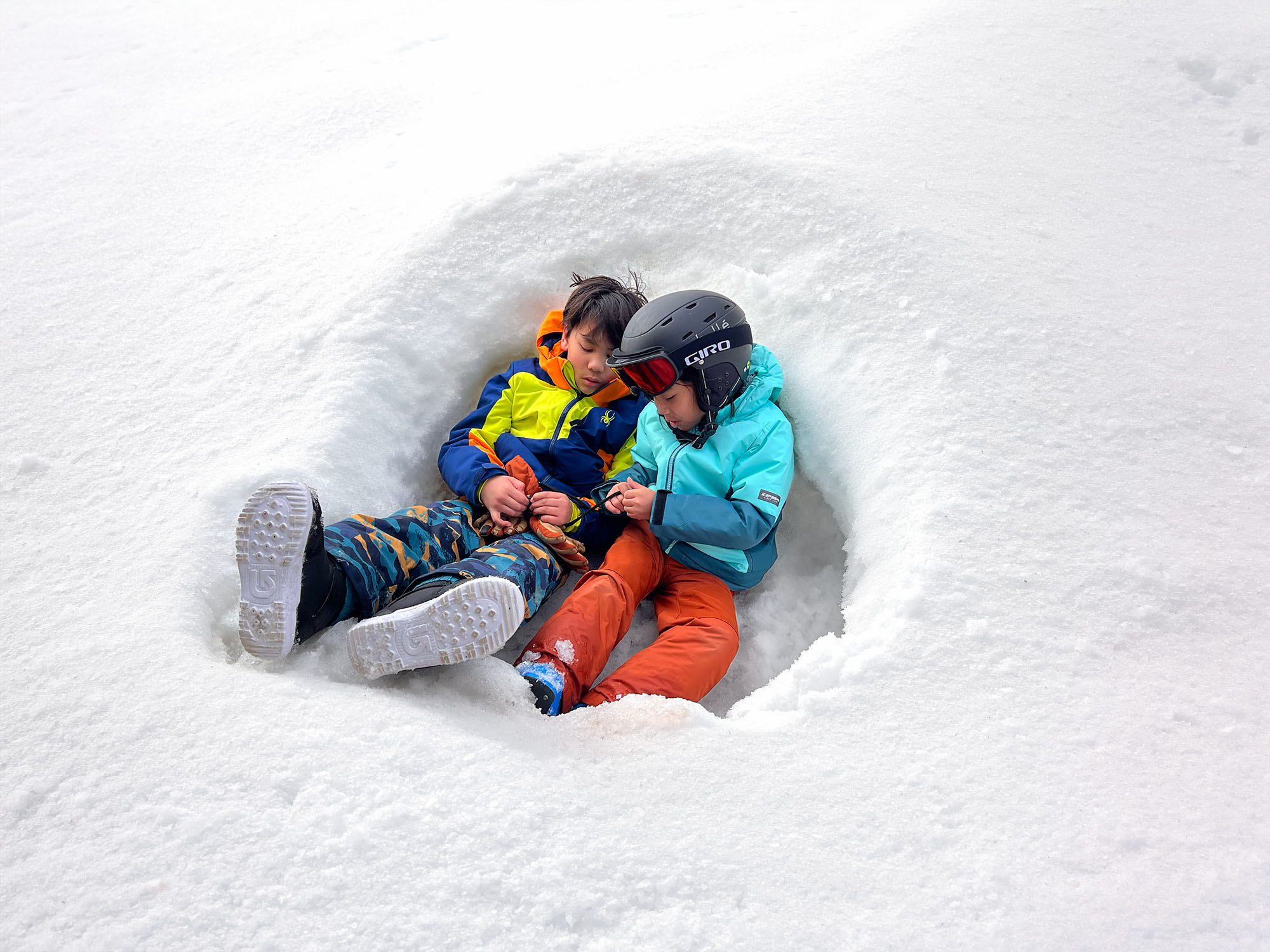 Brothers playing in the snow